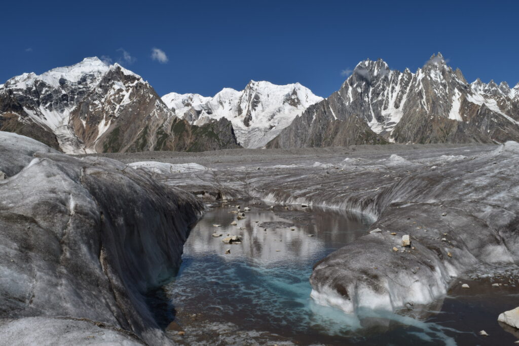 Biafo_Glacier,PakistanIn the heart of the Karakoram Mountains, a realm of frozen wonders beckons the adventurous soul—the Biafo Glacier. Stretching across a majestic expanse of 63 kilometres, this icy giant is more than just a glacier; it's a journey through time, an odyssey through ice and stone that ignites the senses and stirs emotions. As you embark on this voyage into a world untouched by time, prepare to be swept away by the symphony of ice and the whispers of ancient history.