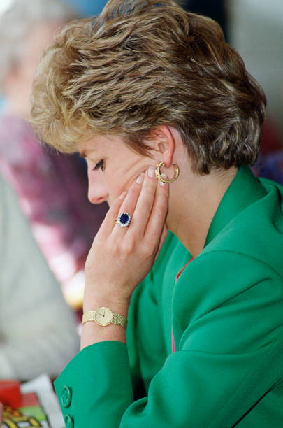 UNITED KINGDOM - APRIL 28: Diana, Princess Of Wales, Wearing Her Diamond And Sapphire Engagement Ring Bought From 'garrards, The Crown Jewellers With A Gold Watch And Gold Earrings (Photo by Tim Graham Photo Library via Getty Images)