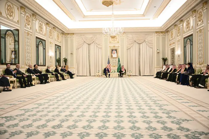 President Trump and Crown Prince Mohammed bin Salman flanked by representatives on either side. Brendan SMIALOWSKI / AFP