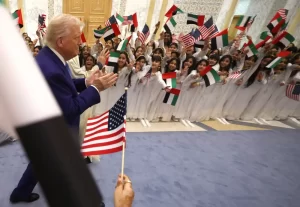 Children waved flags to welcome President Trump in the United Arab Emirates. Win McNamee/Getty Images
