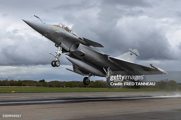 A French multirole fighter aircraft Rafale takes off while practicing a simulated landing on a aircraft carrier at the French Navy airbase of Landivisiau in Saint-Servais, western France on April 16, 2025. (Photo by Fred TANNEAU / AFP) (Photo by FRED TANNEAU/AFP via Getty Images)