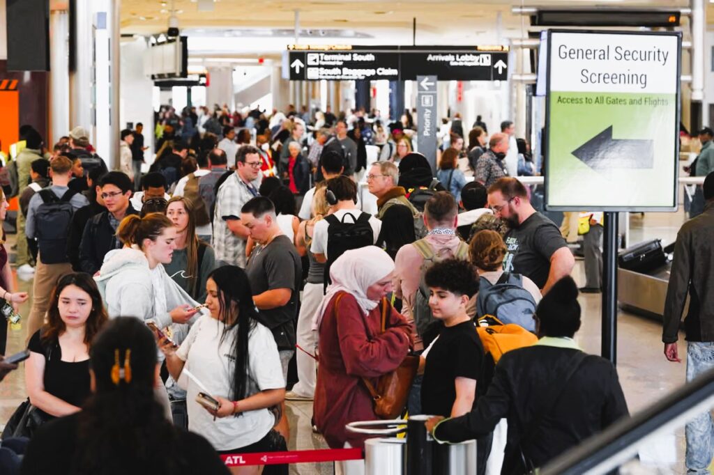 Passengers wait in long TSA lines as a partial government shutdown