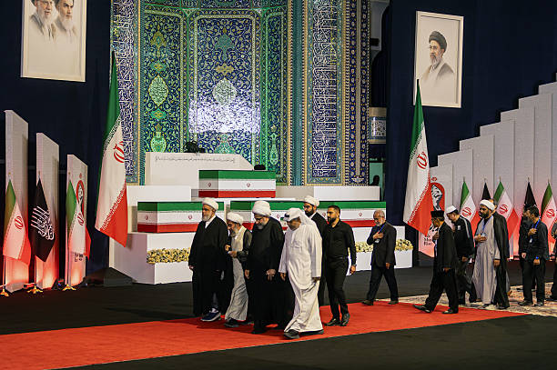 TEHRAN, IRAN - JULY 3: Foreign and domestic officials pass the coffins containing the late Iranian Supreme Leader, Ayatollah Ali Khamenei, and members of his family at Imam Khomeini Grand Mosque on July 3, 2026 in Tehran, Iran. Khamenei and members of his family were killed on February 28 during U.S.-Israeli strikes at the beginning of the war, bringing an end to his 36-year rule over Iran. A multi-city state funeral will be held over six days before his body is laid to rest on July 9, in his hometown of Mashhad, Iran. (Photo by Majid Saeedi/Getty Images)